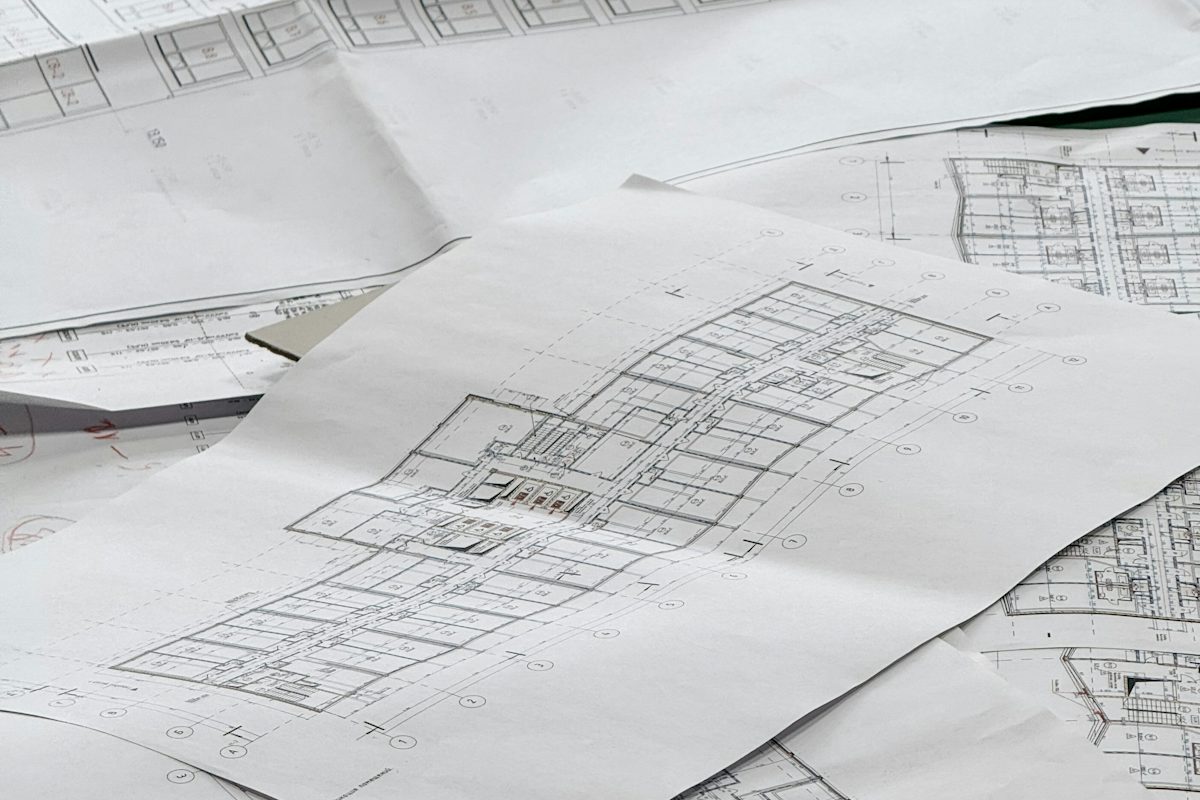 Architectural plans spread on a desk